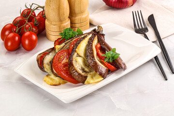 Baked tomato with mozzarella and tomato