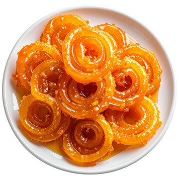 Traditional Indian jalebi dessert served on white plate with crispy texture and golden syrup glaze isolated on transparent background