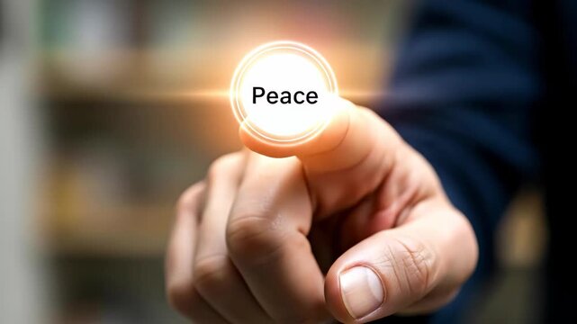 Hand Pressing Glowing Peace Button - Close-up of a hand pressing a glowing circular button with the word "Peace" on it. The button emits a soft white aura, suggesting a positive and hopeful concept.