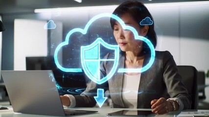 Asian Businesswoman Working with Holographic Cloud Security and Data Protection Icons in Modern Office - Powered by Adobe