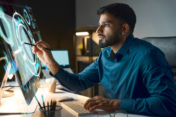 Focused Tech Professional Interacts With Futuristic Holographic Display While Working On Desktop