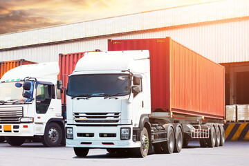 Semi Trailer Trucks on The Parking Lot at The Warehouse. Shipping Cargo Container. Trucks Loading Goods at Dock Warehouse. Distribution Warehouse. Big rig. Freight Logistics Truck Transport.	

