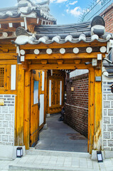 Entrance house in Hanok village unique traditional Korean houses, with doors and windows made of wood.a place where tourists visit in Seoul South Korea.
