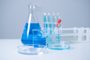 Laboratory glassware test tube beaker flask pipette science research experiment education hospital analysis vaccine antibiotic development DNA chemist biochemistry biotechnology discovery innovation