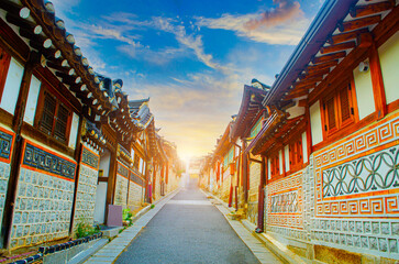 Sunset colors at Bukchon Hanok Village, Seoul, South Korea. A walkway to admire the architecture of traditional Korean houses.