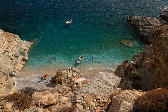 Drone aerial view to tropical Seychelles beach embedded in rugged granite cliffs, Ikaria, Greek Islands 