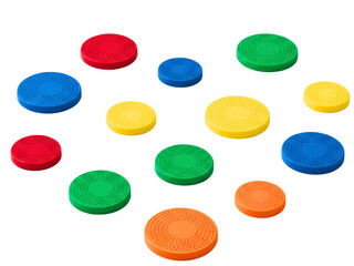 Assortment of colorful round textured plastic game counters on a transparent background