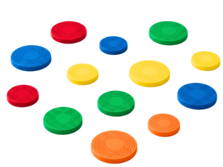 Assortment of colorful round textured plastic game counters on a transparent background