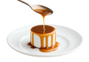 Caramel sauce poured over small white dessert