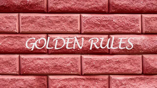 Animation of the GOLDEN RULES conceptual text on a fragment of a red brick wall. The concept of business rules, behavior