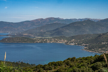 Spectacular view Golf at Sagone Corsica France beautyful sand Beach boats mountain village Tourism and vacations concept