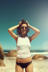 Happy, tourist and woman on vacation, beach and mockup space on getaway, view and adventure on trip. Outdoor, traveller and person with shades on summer holiday, tourism and smile in nature or sea