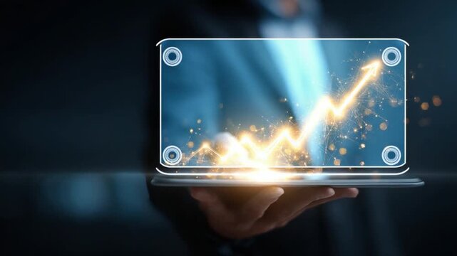 Financial Growth Projection: A modern person holds a holographic display showcasing a vibrant graph, symbolizing exponential growth, illuminated with golden light.