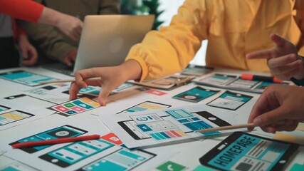 A creative team engages in a collaborative design session, exploring digital mockups for an application and webpage, fostering innovation and visual solutions. SACTR - Powered by Adobe