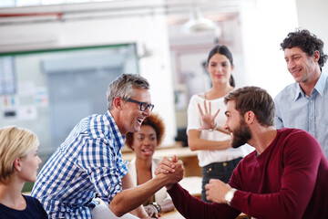 Handshake, business and men in office, teamwork or creative agency with proposal approval. Shaking hands, people or employees in meeting, success or design group with thank you, contract or agreement