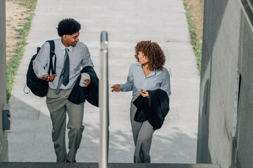 business people walking up the stairs