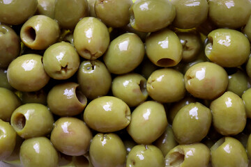 Pickled Green Olives. A healthy food for a healthy diet. Green olives pickled in olive oil.