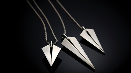 A photo of a sleek geometric silver jewelry set.