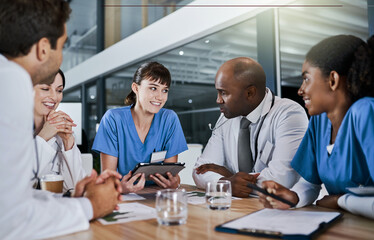Fototapeta premium Tablet, discussion and team of doctors in hospital with planning for medical treatment in collaboration. Technology, meeting and group of healthcare workers with research for surgery in clinic.