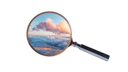 A magnifying glass focuses on a sunset sky view of clouds