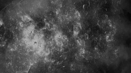 Dark abstract grunge background with smoky textures and cloudy formations in black and gray tones. Chaotic, atmospheric design resembling a cosmic nebula or ink in water effect.