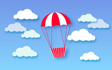 Hot air balloon in a blue sky with clouds