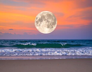 Obraz premium Full moon over a tranquil beach at sunset