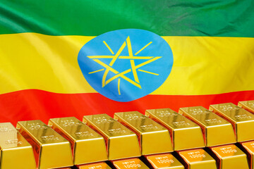 Row of gold bars on the Ethiopia flag background. Concept of gold reserve and gold fund of Ethiopia