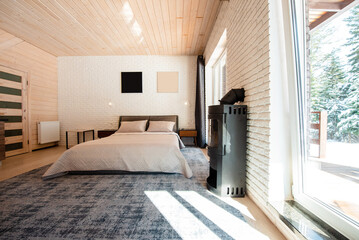 Modern Bedroom with Wooden Ceiling and Large Window