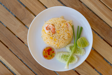 Rice blowing shrimp is a delicious and useful Thai food on a wooden table.