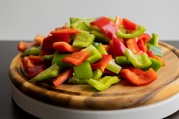 Sliced Green and Red Bell Peppers on Wooden Cutting Board