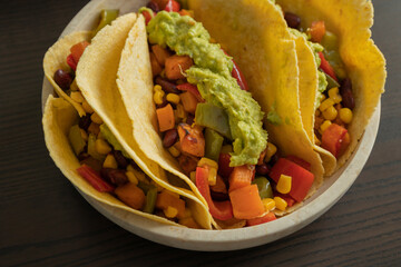 Corn Tortilla Tacos with Sweet Potato, Beans, Peppers and Smashed Avocado