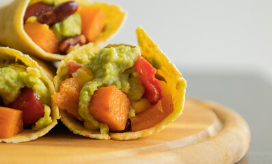 Corn Tortilla Tacos with Sweet Potato, Beans, Peppers and Smashed Avocado
