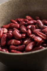 Red Beans in Dark Bowl on Moody Black Background Close-Up