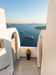 Fototapeta premium White architecture in Santorini island, Greece. Beautiful seascape at sunset.