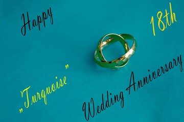 Gold Wedding Rings with Turquoise Accents &ndash; 18th Anniversary. Artistic composition of gold wedding rings with turquoise color accents, symbolizing protection, harmony, and 18th wedding anniversary.