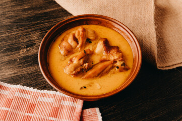 A delicious chicken curry dish served in a rustic bowl, great for comforting and heartwarming meals