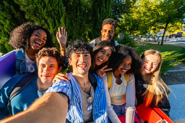 Diverse university students taking a joyful campus selfie