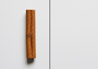 Single Cinnamon Stick Flat-lay Product Photo