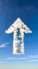 Obraz premium Upward pointing cloud arrow in a clear blue sky