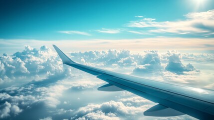 Obraz premium Capture the serene beauty of clouds and blue sky from a plane window, Position the subject on the right against shimmering aqua tones, leaving ample copy space on the left for text or design elements.