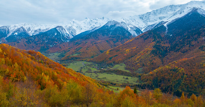 Fototapeta Breath taking view of evening sunset scene a mountain in  Autumn scene with snow at Mestia Georgia, autumn forest