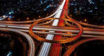 Dynamic nighttime traffic flow urban intersection aerial view city environment long exposure concept
