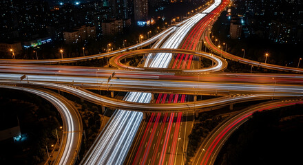 Dynamic nighttime traffic flow at urban intersection long exposure photography cityscape aerial view modern infrastructure