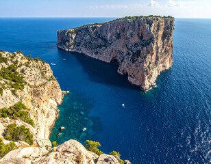 Rock cliffs on the blue ocean beach