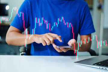 Hand using a stylus on tablet with digital trend graph overlay and laptop. Ideal for fintech, analytics, report, chart,