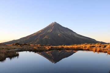 	
Scenic view of Mount Taranaki at sunrise in New Zealand	

