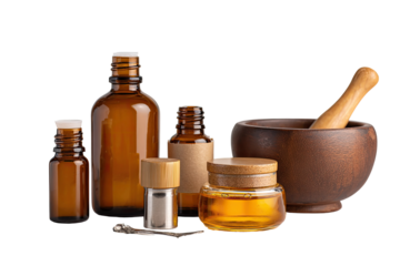 Amber glass bottles, wooden mortar & pestle, and a jar, suggesting natural remedies or aromatherapy