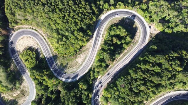 Aerial view of winding asphalt mountain road among green trees in summer. (Domani&ccedil;,İneg&ouml;l dağ yolu)	