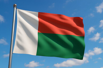 Madagascar flag waving under a bright blue sky.